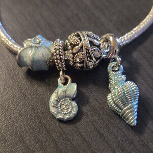 New Set of 4 seashell ocean theme charms for bracelet or necklace Pandora style